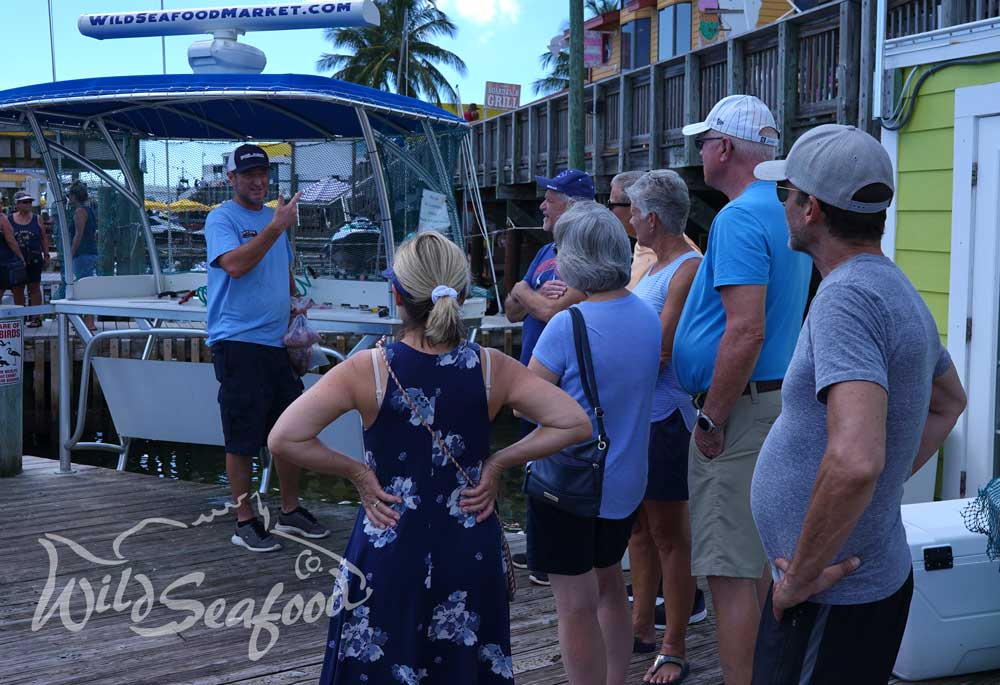 Teaching public about sustainable fishing on dock in Florida