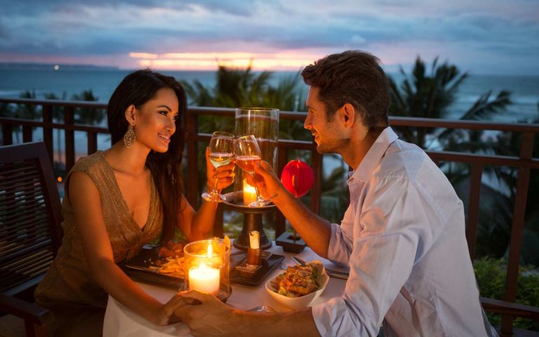 Couple eating seafood dinner romantic