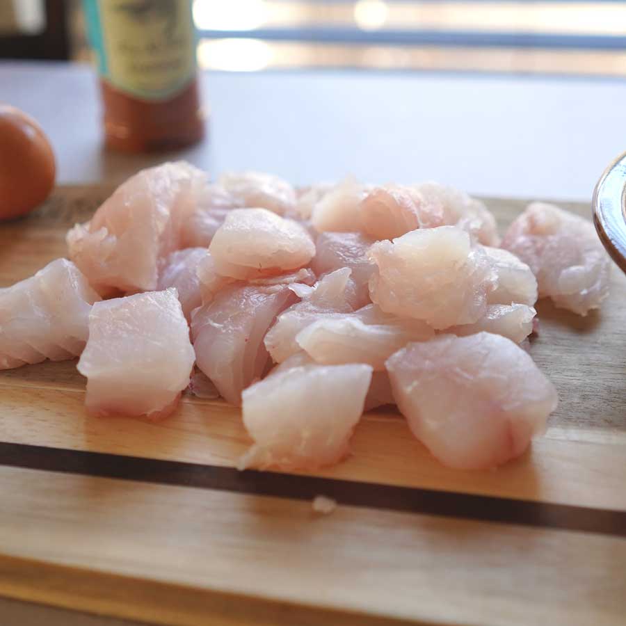 Fresh, raw red snapper chopped up